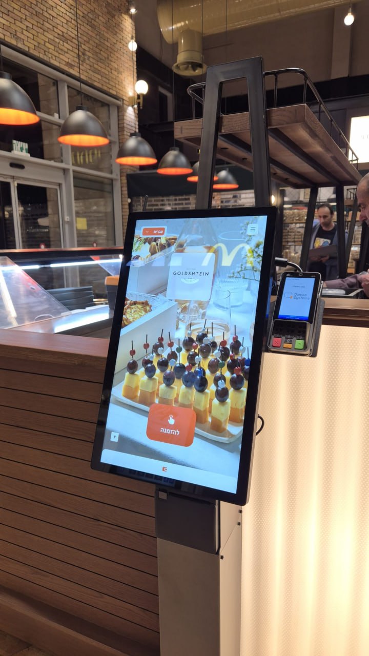 Self-service kiosk and payment terminal installed inside a food business