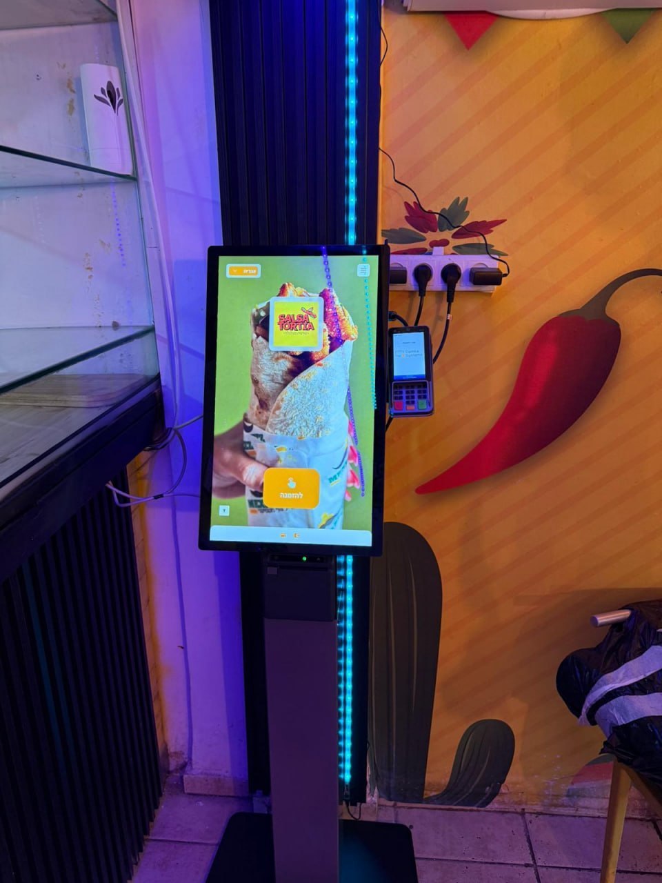Self-service ordering kiosk installed at a takeaway counter